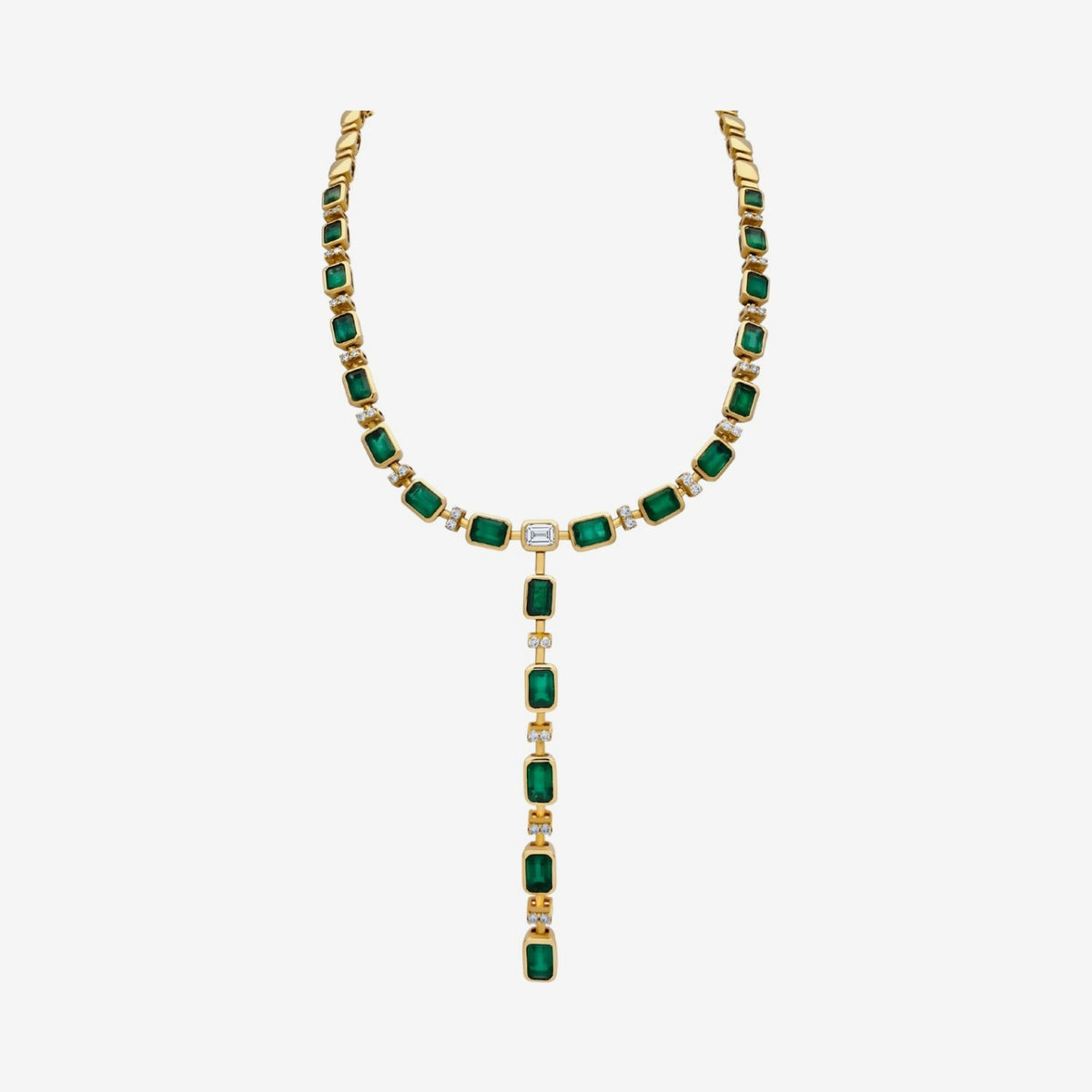 Emerald and Diamond Lariat Necklace in 18K Yellow Gold, angle 2, gray background | JJ Jewelry Miami