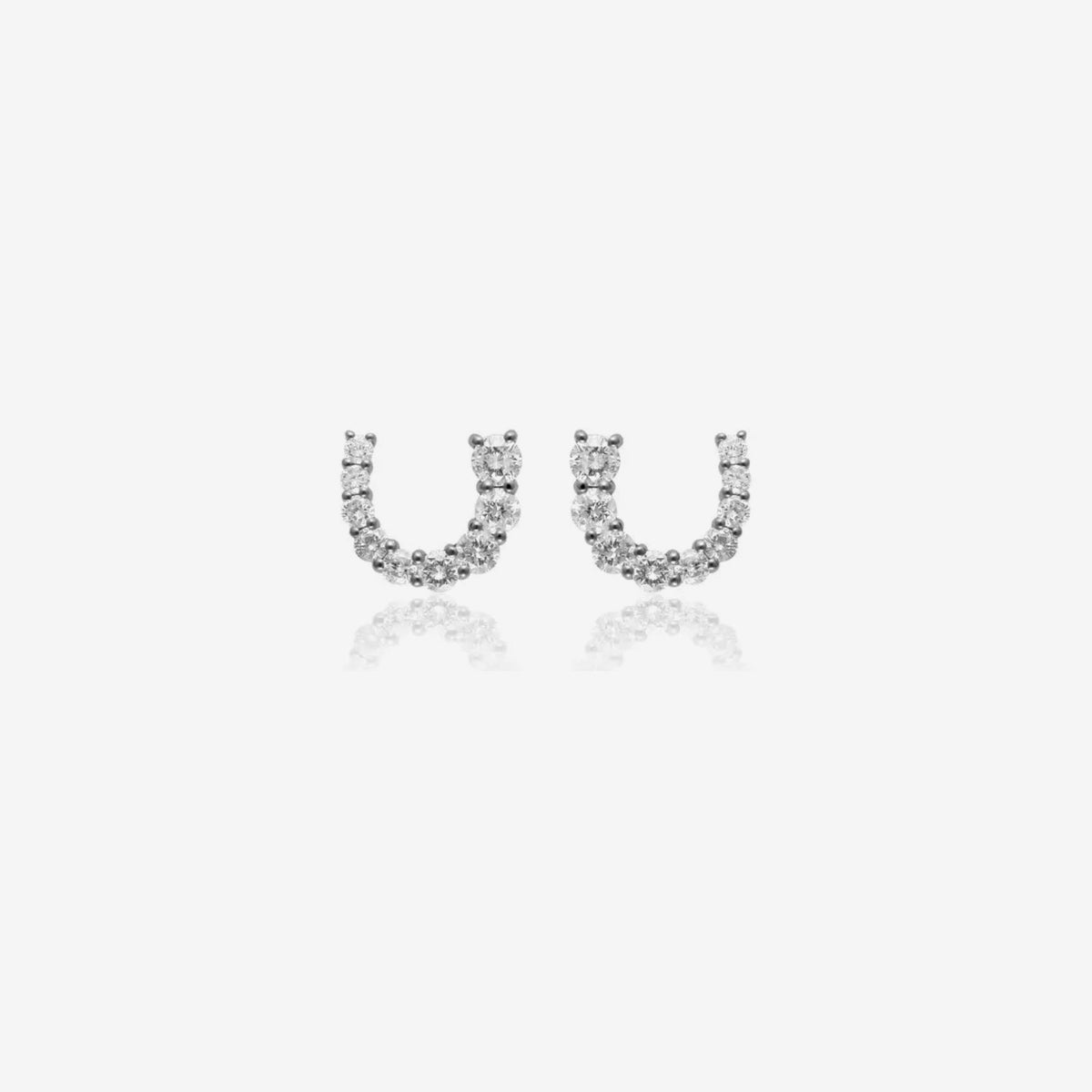 Horseshoe Diamond Stud Earrings in 18K White Gold, gray background | JJ Jewelry Miami