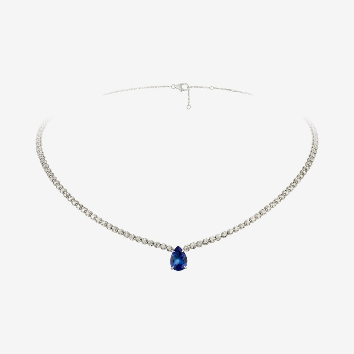 Pear Tanzanite and Diamond Necklace in 18K White Gold, gray background | JJ Jewelry Miami