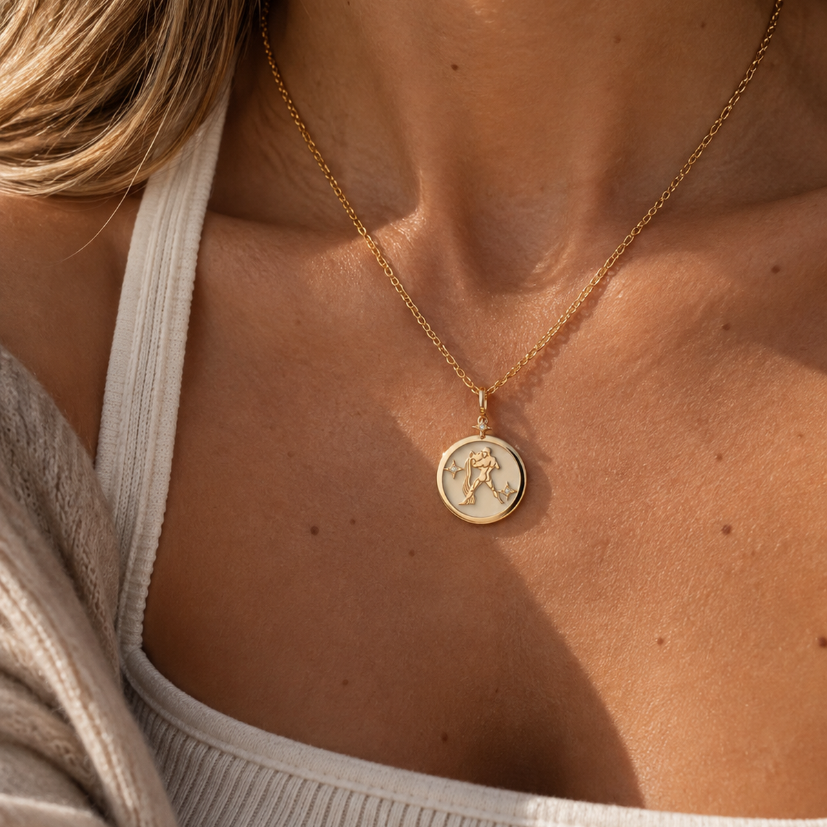 Aquarius Zodiac Pendant in 18K Yellow Gold with White Quartz & Diamonds, worn on a fine gold chain | JJ Jewelry Miami