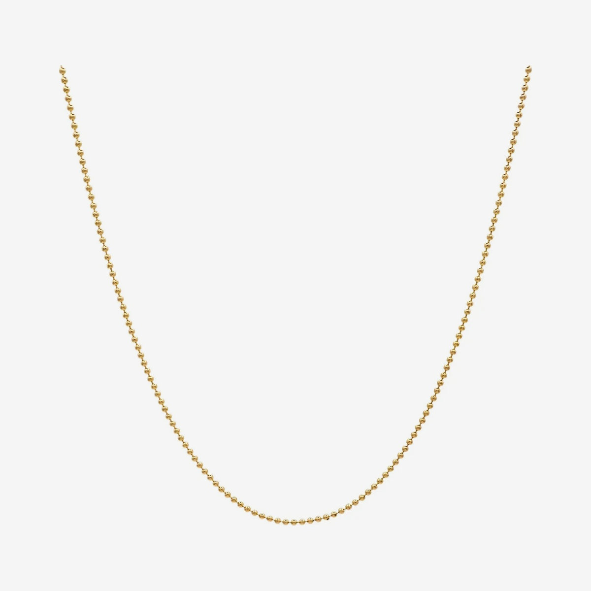 Mini Ball Chain Necklace in 14K Yellow Gold, gray background | JJ Jewelry Miami