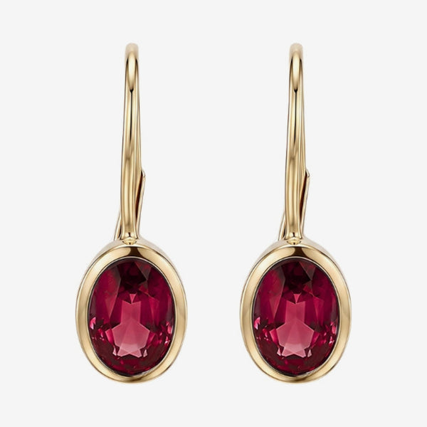 Oval Bezel Gemstone Leverback Earrings in 14K Yellow Gold with Ruby, gray background | JJ Jewelry Miami