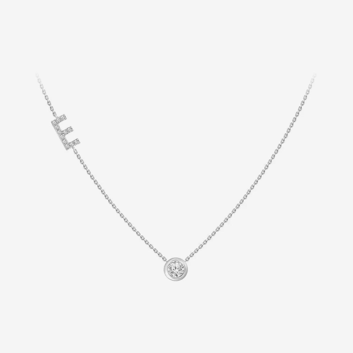 Pavé Diamond Initial Necklace, Letter E, in 18K White Gold, gray background | JJ Jewelry Miami