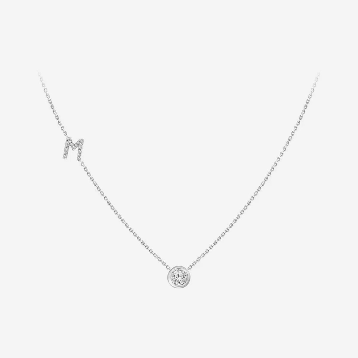 Pavé Diamond Initial Necklace, Letter M, in 18K White Gold, gray background | JJ Jewelry Miami