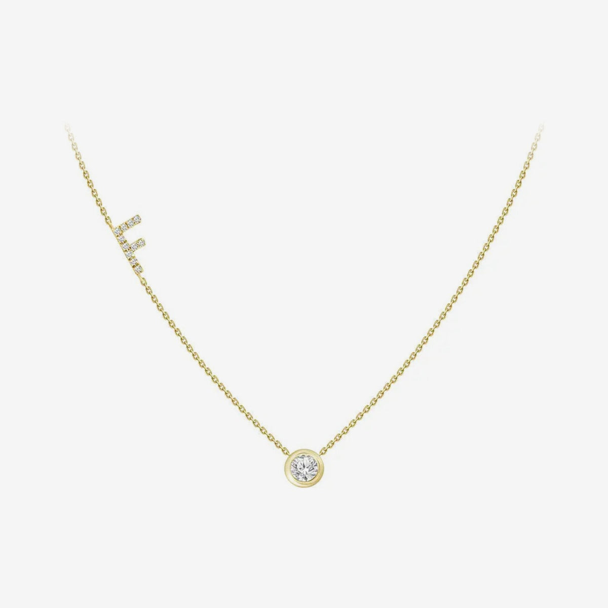 Pavé Diamond Initial Necklace, Letter F, in 18K Yellow Gold, gray background | JJ Jewelry Miami