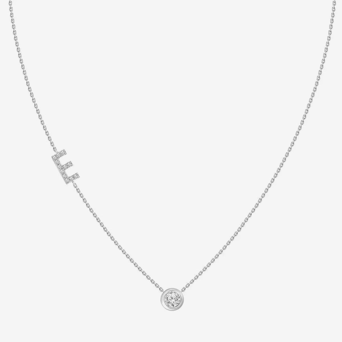 Pavé Diamond Initial Necklace, Letter E, in 18K White Gold, gray background | JJ Jewelry Miami