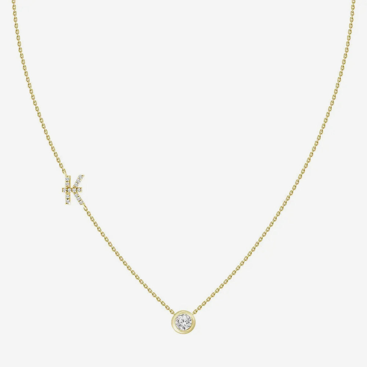 Pavé Diamond Initial Necklace, Letter K, in 18K Yellow Gold, gray background | JJ Jewelry Miami