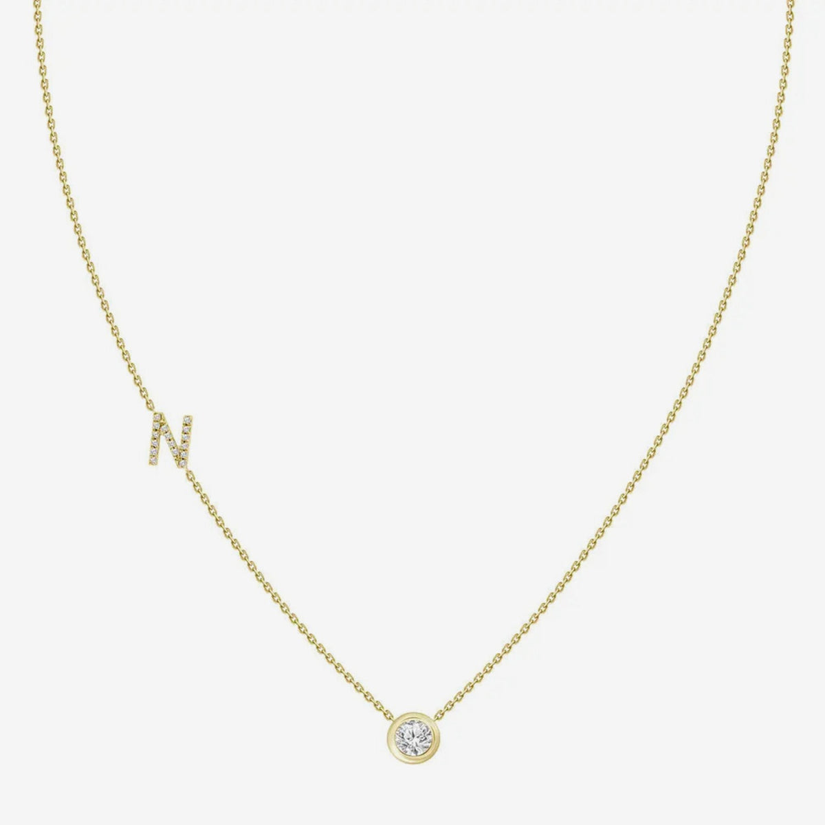 Pavé Diamond Initial Necklace, Letter N, in 18K Yellow Gold, gray background | JJ Jewelry Miami
