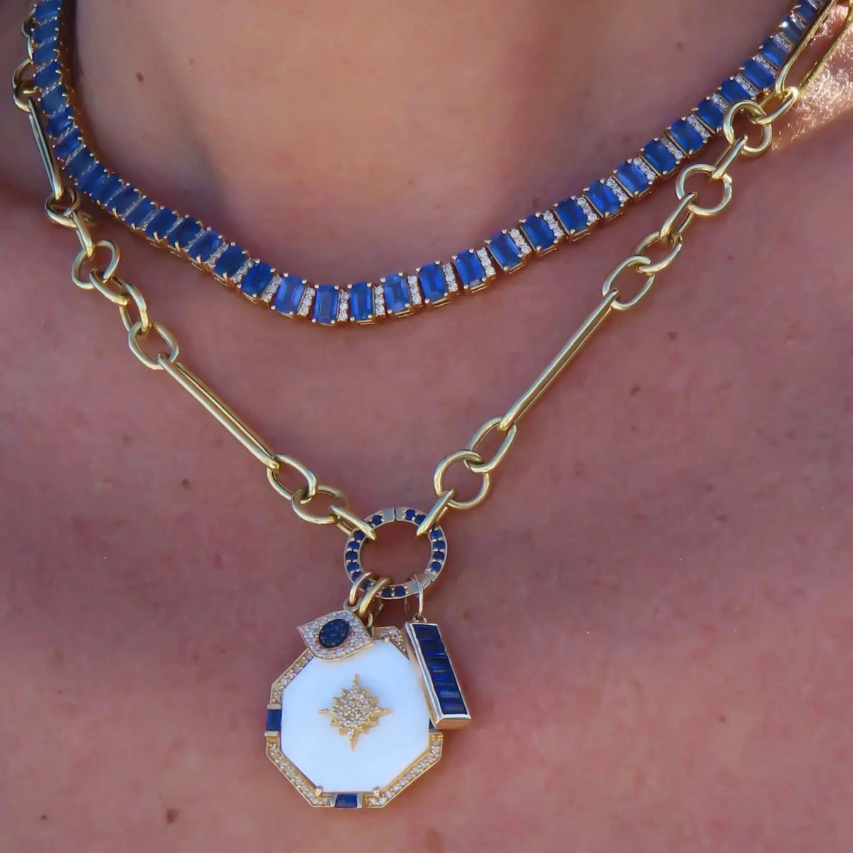 Octagon pendant with blue sapphires pavé diamonds and mother-of-pearl center