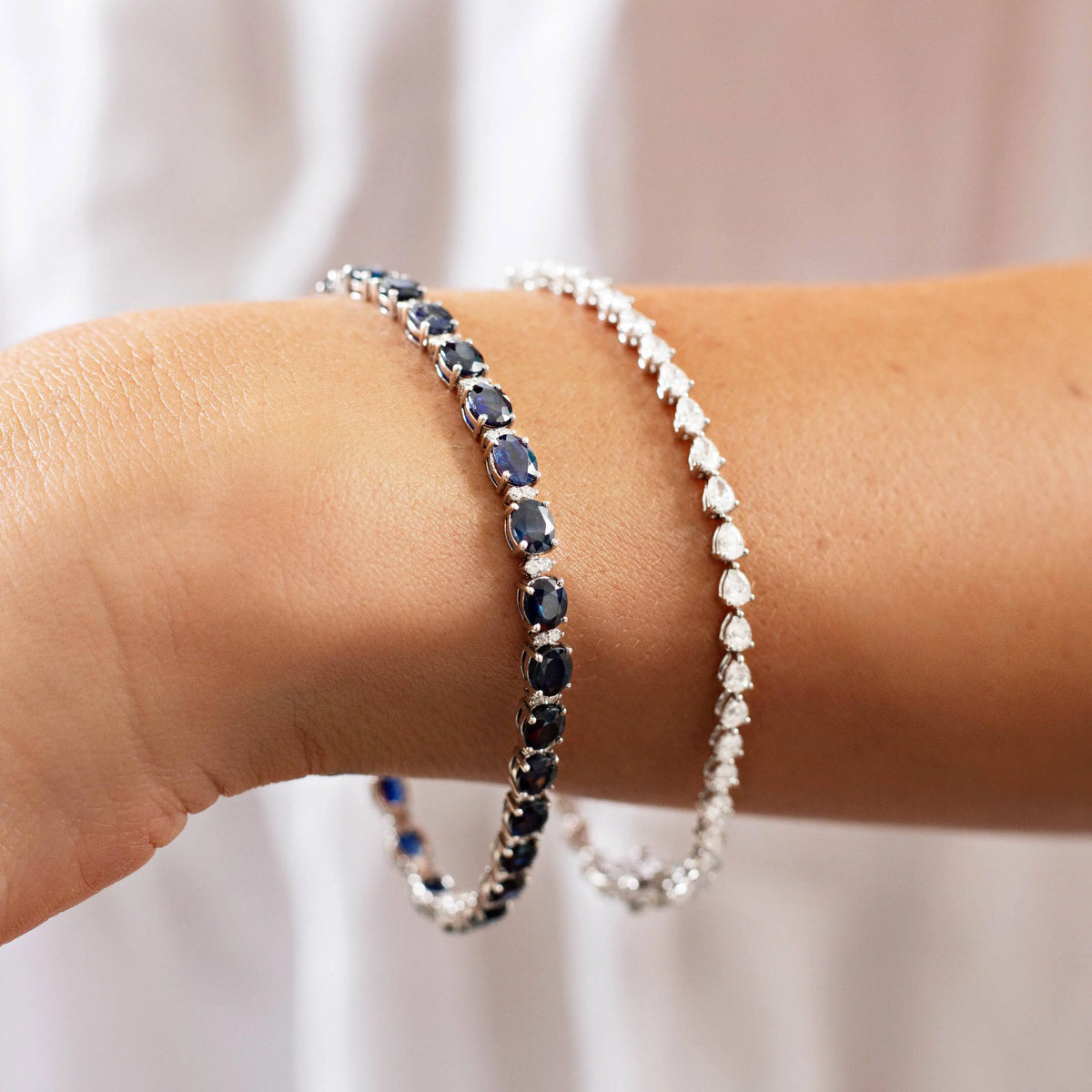 Oval Blue Sapphire and Diamond Line Bracelet in 18K white gold, lifestyle view 2 | JJ Jewelry