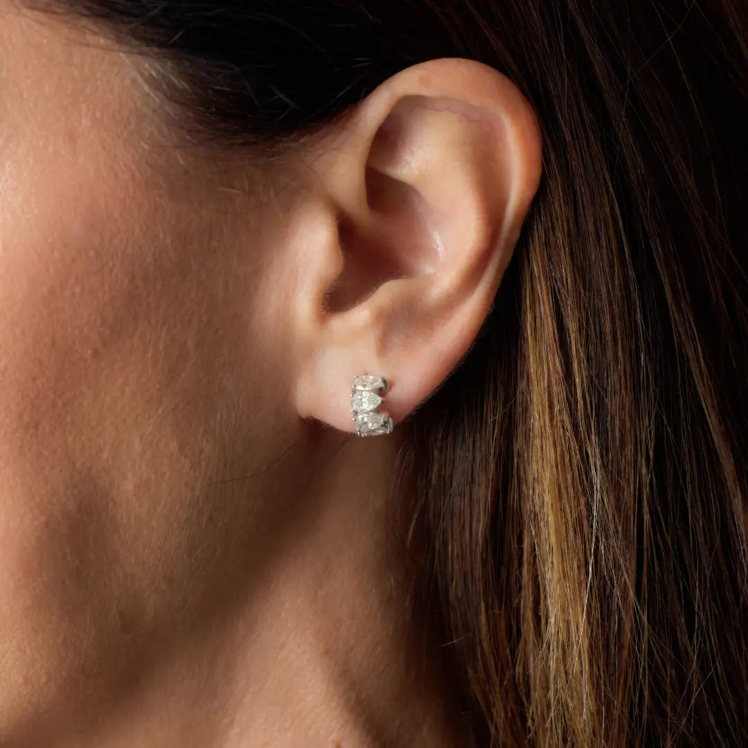Pear Diamond Hoop Earrings in 18K White Gold, on ear | JJ Jewelry Miami