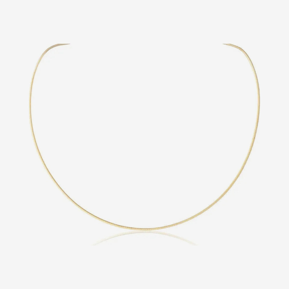 Flex String Chain Necklace in 18K Yellow Gold, gray background | JJ Jewelry Miami