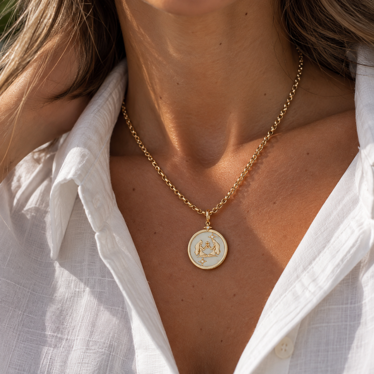 Gemini Zodiac Pendant in 18K Yellow Gold with White Quartz & Diamonds, worn on a gold chain | JJ Jewelry Miami
