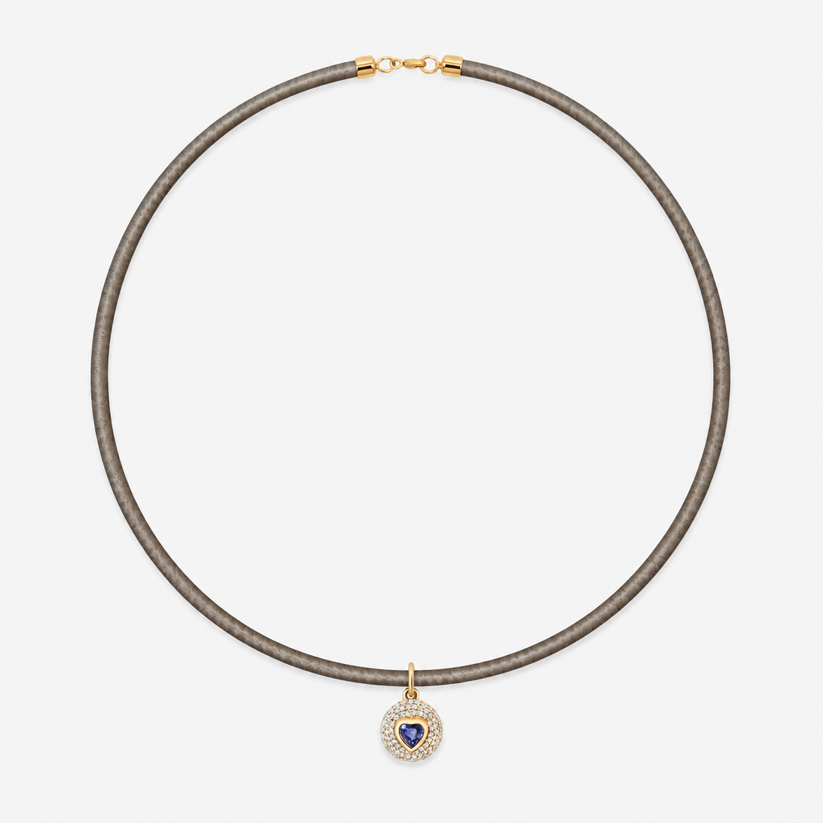 Gemstone Heart Pavé Disc Pendant in 14K Yellow Gold, Blue Sapphire, styled on a taupe cord choker | JJ Jewelry Miami