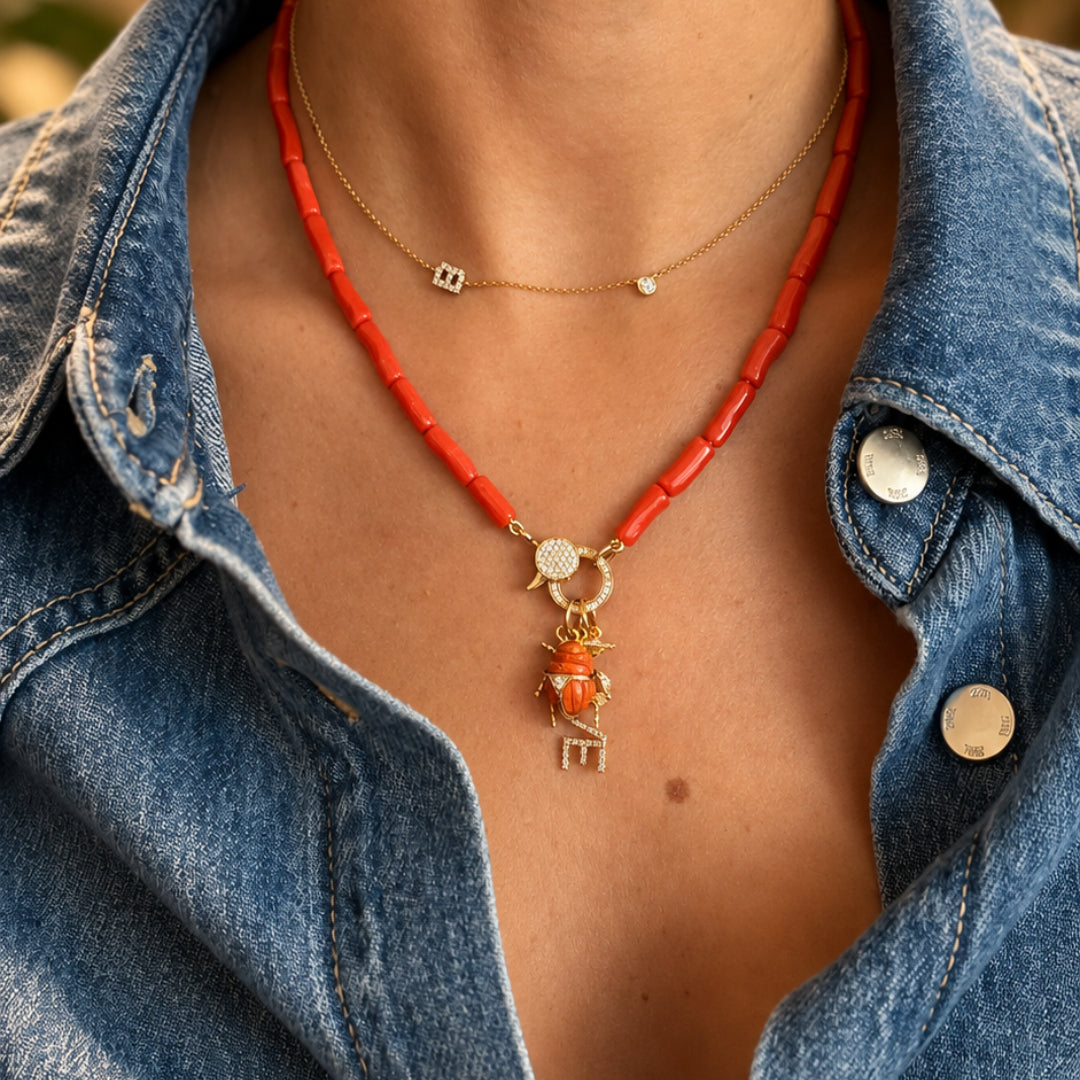 Gemstone Scarab Beetle Pendant in 14K Yellow Gold, Coral, worn on a coral bead necklace | JJ Jewelry Miami
