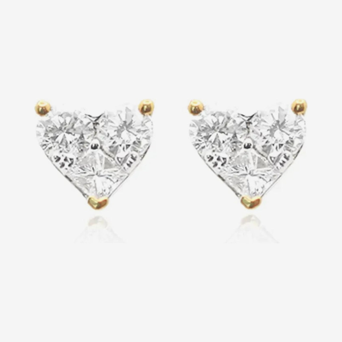 Heart Diamond Stud Earrings in 18K Yellow Gold, gray background | JJ Jewelry Miami