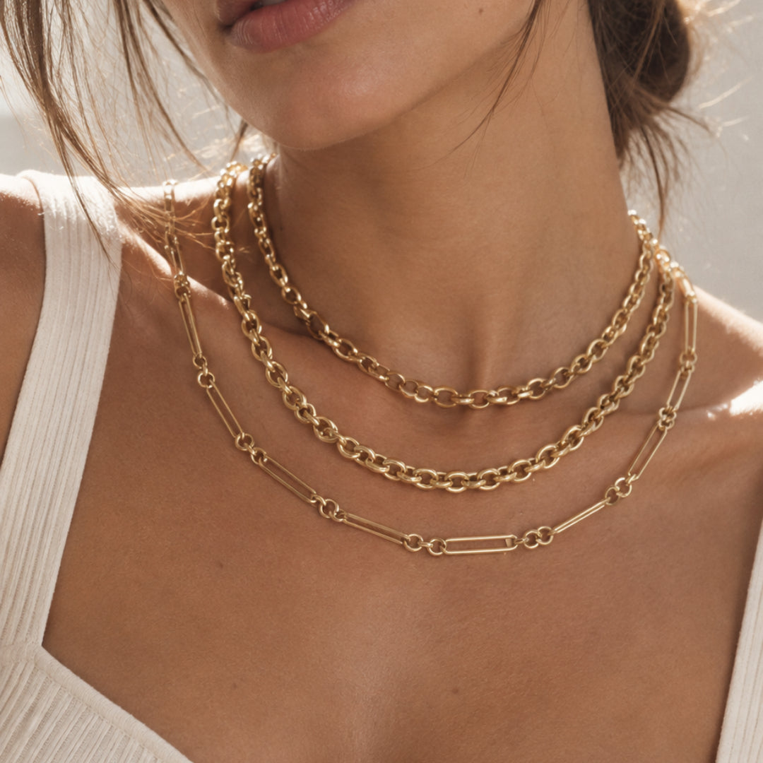 Oversized Oval Link Chain Necklace in 14K Yellow Gold layered on model | JJ Jewelry Miami