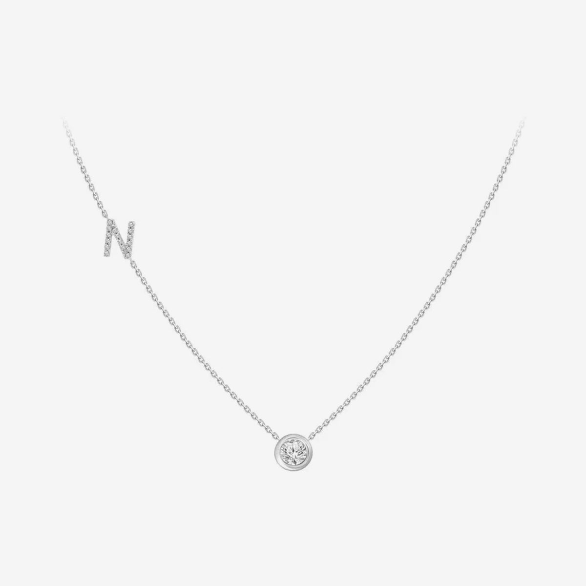 Pavé Diamond Initial Necklace, Letter N, in 18K White Gold, gray background | JJ Jewelry Miami