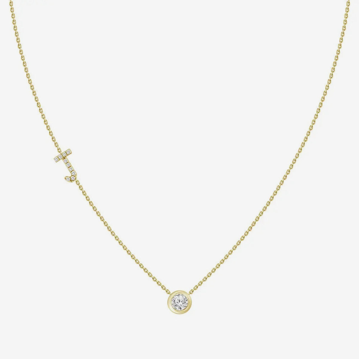 Pavé Diamond Initial Necklace, Letter J, in 18K Yellow Gold, gray background | JJ Jewelry Miami