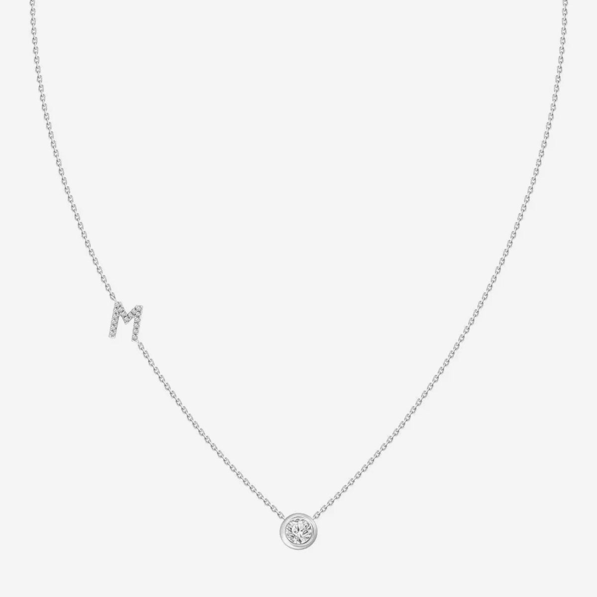Pavé Diamond Initial Necklace, Letter M, in 18K White Gold, gray background | JJ Jewelry Miami