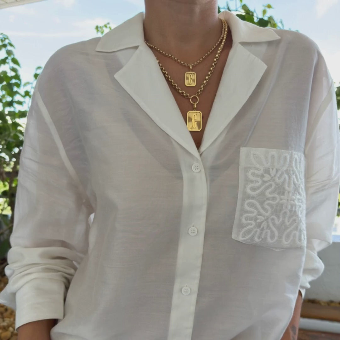Small and Large Initial Medal Pendants in 18K Yellow Gold layered on model, video | JJ Jewelry Miami