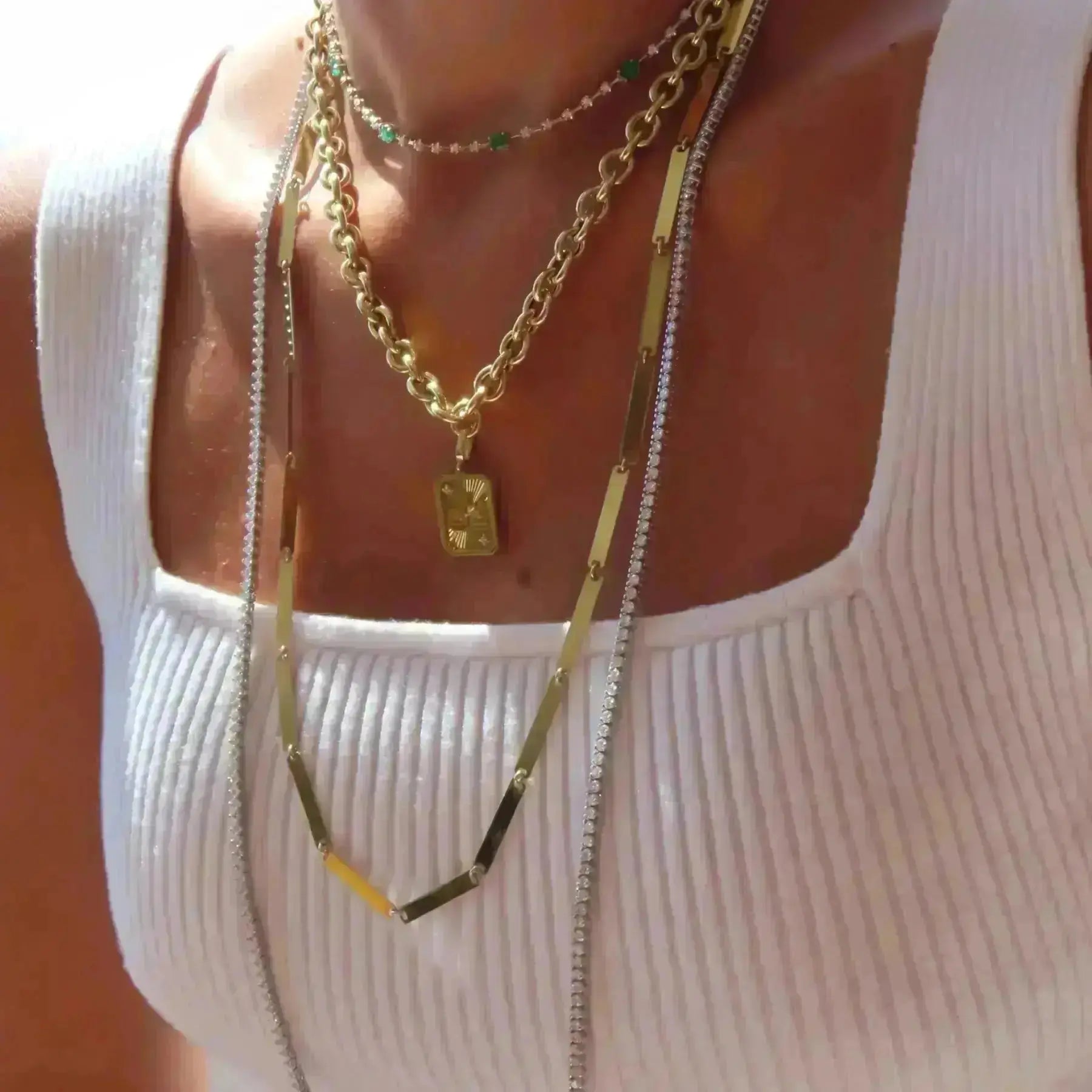 18K gold zodiac pendant with engraved traits and diamond details